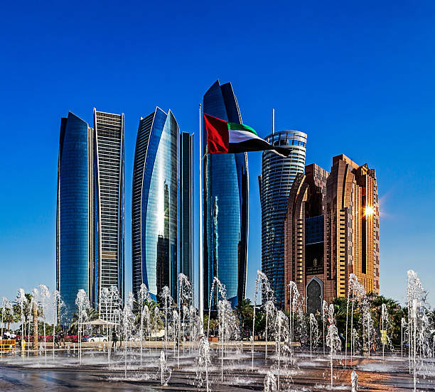 Abu Dhabi, United Arab Emirates  December 20, 2019: View of Etihad Towers with the national flag of UAE