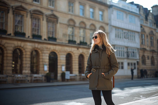 istock Young Woman Walking along Oxford, UK 2213041379