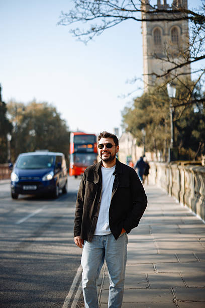 istock Young Man Walking along Oxford, UK 2213041693