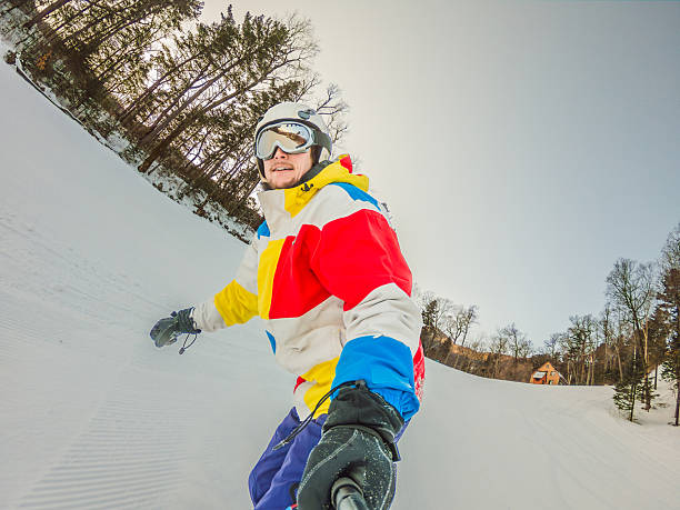 istock A daring man conquers snowy slopes with style, showcasing skill and thrill as he maneuvers on a snowboard, capturing the essence of winter adventure 2213042350
