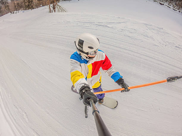 istock A daring man conquers snowy slopes with style, showcasing skill and thrill as he maneuvers on a snowboard, capturing the essence of winter adventure 2213042352