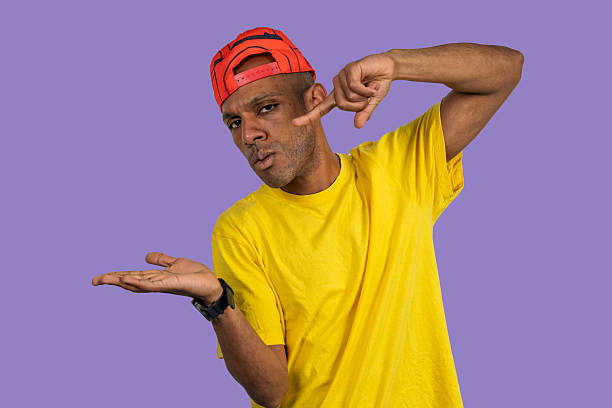 istock Confused man pointing at head and shrugging shoulders 2213042658