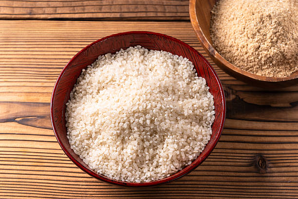 istock Polished white rice and rice bran 2213044792