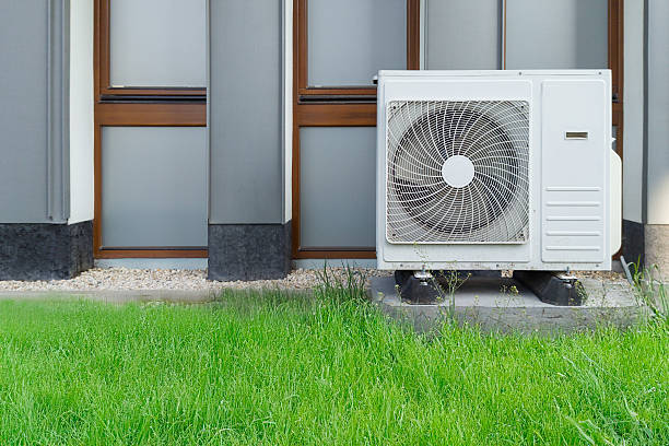 istock Outdoor air conditioner unit on building wall 2213046804