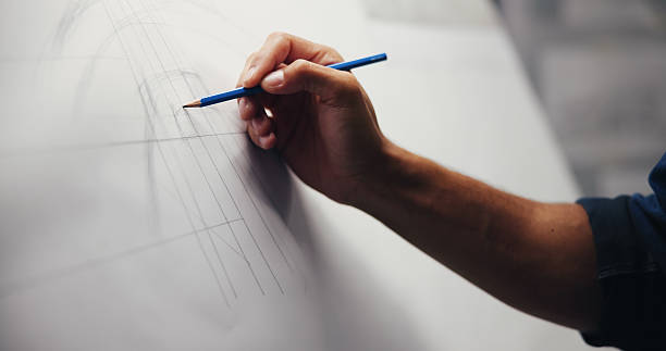 istock Hand, drawing or man in office, architecture or blueprints for renovation project. Urban developer, closeup or engineering with paper, charts or property development with deadline, artistic or sketch 2213051410