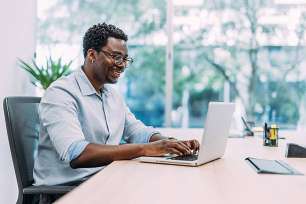 istock Successful businessman in modern office working on laptop. 2213051692