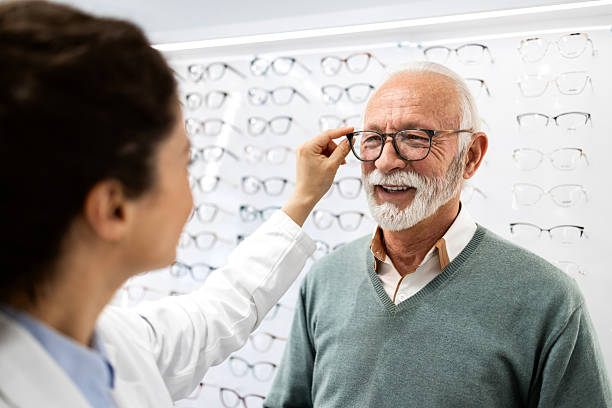 istock Senior patient trying on his new eyeglasses. 2213055585