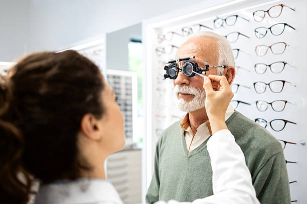istock Senior patient testing eyesight and checking diopter in ophthalmology clinic. 2213056039