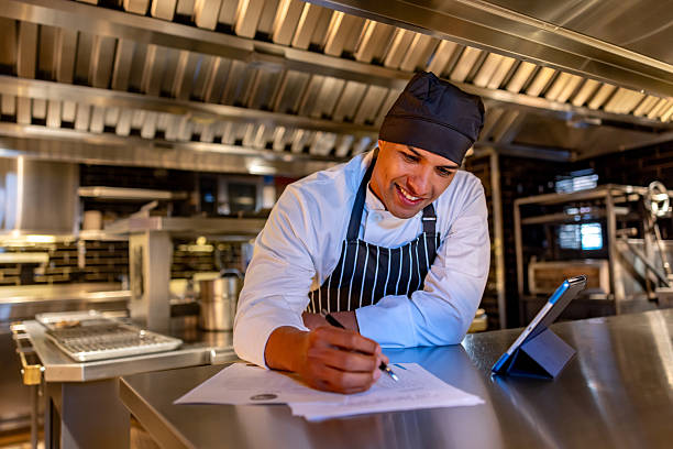 istock Happy chef checking the inventory at a restaurant 2213060103