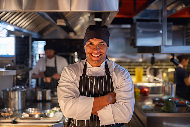 istock Happy chef working in a commercial kitchen at a restaurant 2213060130