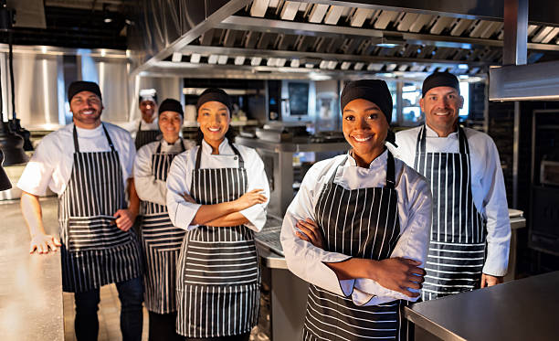 istock Happy group of chefs smiling at a restaurant 2213060190