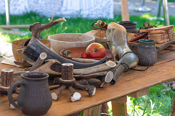 istock Rustic medieval feast table with antlers and drinking horns 2213061439