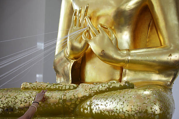 istock Golden Buddha Statue with Intricate Hand Gesture and Details 2213062577