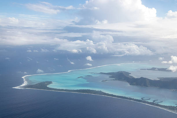 One of the most beautiful aerial views on the planet, Bora Bora is an island group in the leeward islands of Polynesia in the South Pacific Ocean. In the center of the island are the remnants of an extinct volcano, rising to two peaks, Mount Pahia and Mount Otemanu; the highest point is at 727 m (2,385 ft).