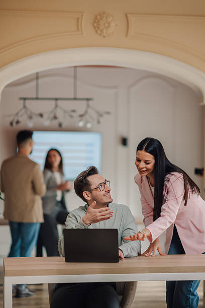 istock Business colleagues collaborating on a project using laptop in modern office 2213065081