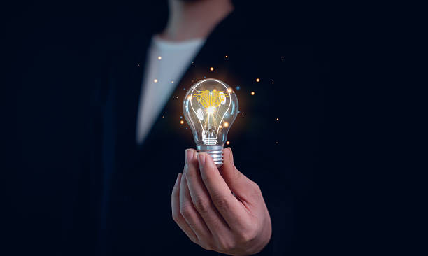istock Hand of  holding illuminated light bulb, Idea innovation and inspiration concept.  creativity with bulbs that shine glitter, Concept for success. 2213068594