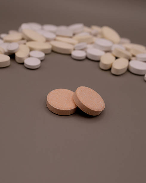 istock white pills and vitamin C 2213069320