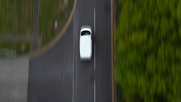 istock White Van Driving Down Country Road 2213072732