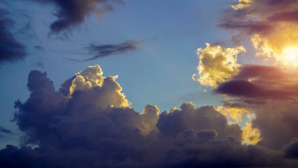 istock Golden sunset sky background, golden clouds, evening with the sun setting. 2213075176