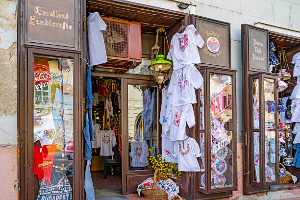 Buda, Budapest, Hungary - April, 2025: Fishermen's Bastion in Buda, Budapest. In the foreground is a shop front on the approach to St Matthias Church in part of the castle area of the city.