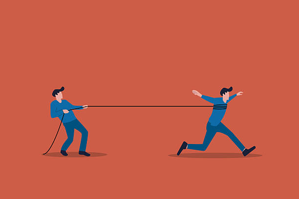 istock Businessman trying hard to run forward from the ropes of the boss 2213076699