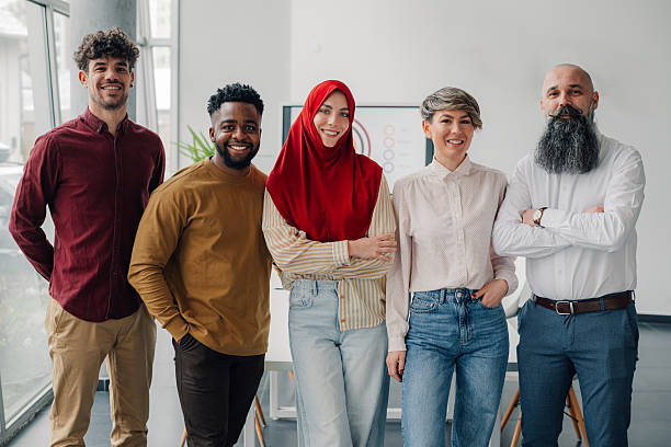 istock Startup business team smiling at camera in the office 2213076920