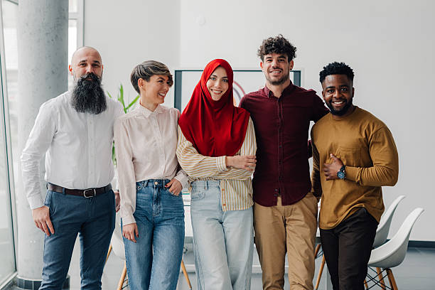 istock Startup business team smiling at camera in the office 2213076937