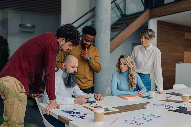 istock Diverse business team analyzing global market data in modern office 2213079997