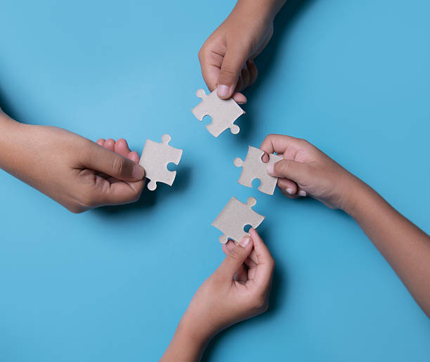 istock Hand connecting jigsaw puzzle, Business solutions, success and strategy, Business partnership concept. 2213082441