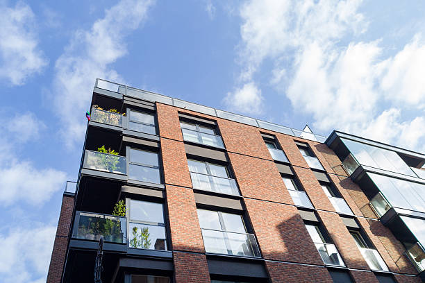 Modern Brick Apartment Building with Glass Balconies