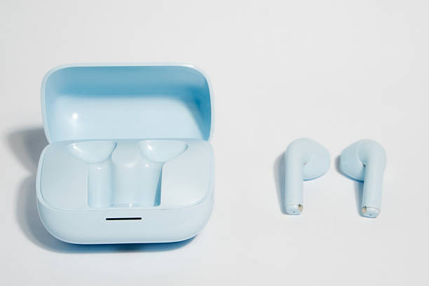 istock Blue Wireless Earbuds in Charging Case for Modern Audio Listening 2213084485