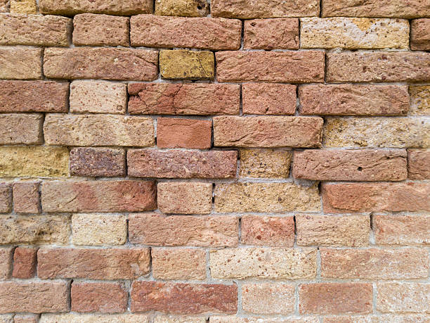 istock Old Textured Wall of Natural Clay Bricks 2213085247
