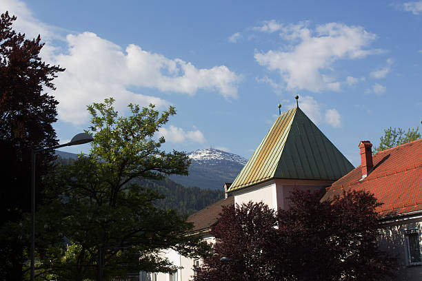 istock Morning light casts shadows on charming architecture framed by the majestic mountains in a serene landscape on a spring day 2213089260