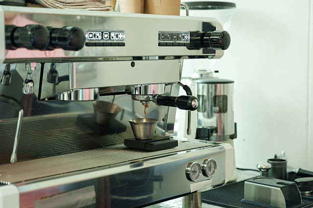 istock Professional barista operating espresso machine preparing fresh coffee in modern cafe, machine gleaming under light, atmosphere expressing passion and dedication, warm cozy family business, 2213090336
