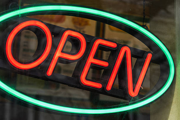 istock Vibrant Neon Open Sign Illuminated in Red and Green Lights 2213091067
