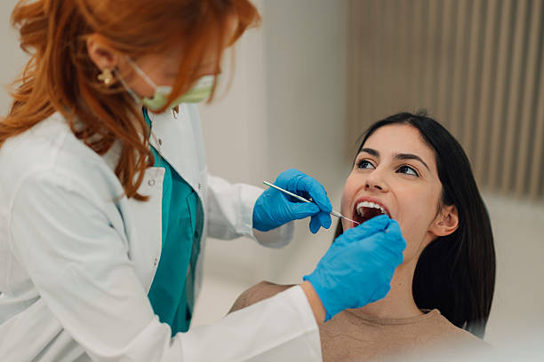 istock Dentist examining patient's teeth in dental clinic 2213091915