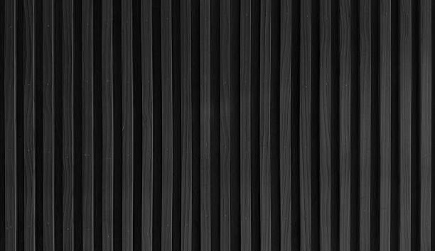 istock uniformly textured surface composed of numerous parallel, dark black wooden slats arranged vertically, creating a clean and simple pattern with subtle variations in tone and shadow. 2213093744