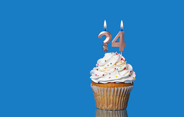 istock Birthday Or Anniversary Cupcake With Lit Candles; Question Mark And Number 4. 2213095091