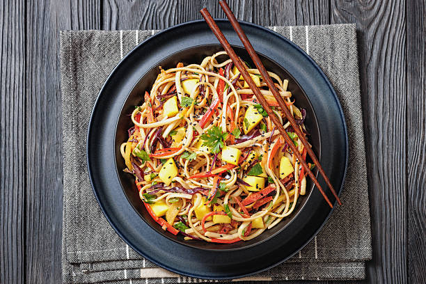 istock Thai Mango Noodle Veggie Salad in a bowl 2213095469