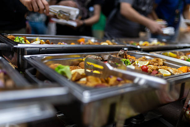 istock Buffet setup featuring a variety of dishes at a gathering during an evening event 2213095622