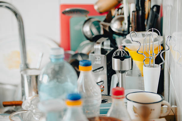 istock Slightly blurred view of a cluttered kitchen countertop featuring various utensils 2213100034