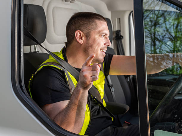 istock Cheerful British Van Driver Gesturing in Hi-Vis Vest 2213101170