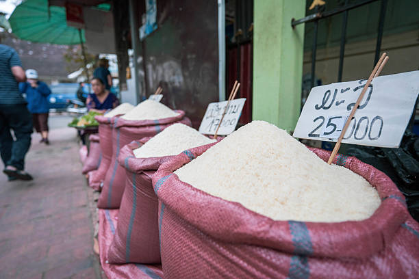 Sacks of white rice are displayed for sale at a market in Luang Prabang, Laos.