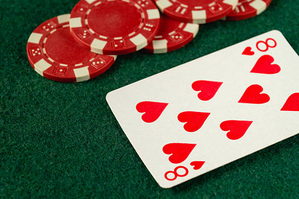 Playing cards in colored lighting.