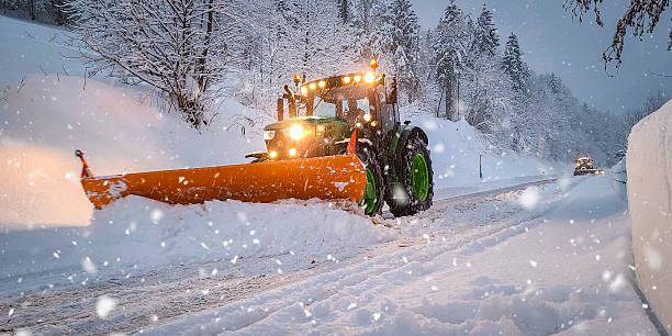 istock Snow Plow Truck Clearing Road During Heavy Snowfall 2213109477
