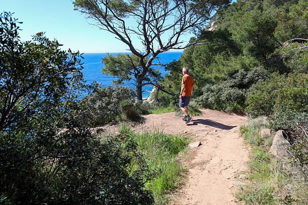 Man hikes coastal pathway, Porto