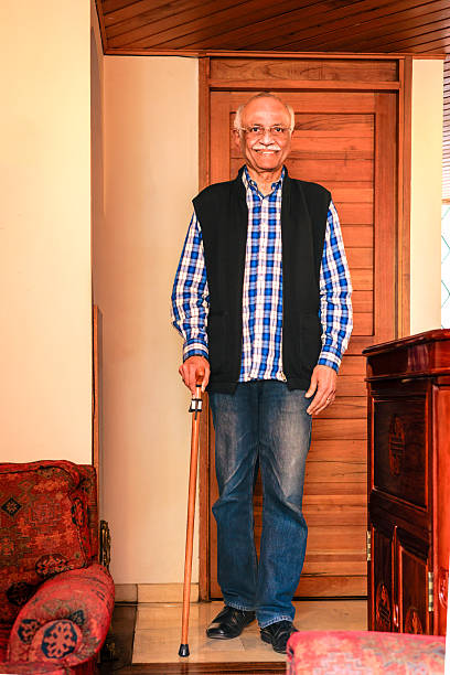istock Senior Indian Man With Walking Cane 2213111236