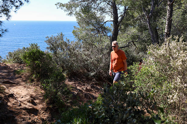 istock Man hikes coastal pathway, Porto 2213111264