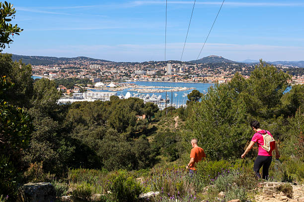 Man hikes pathway above city and bay, Porto