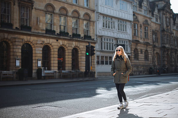 istock Young Woman Walking along Oxford, UK 2213112168